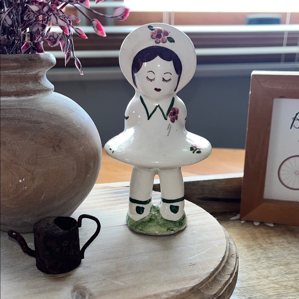 Vintage Ceramic Figurine with Floral Accents